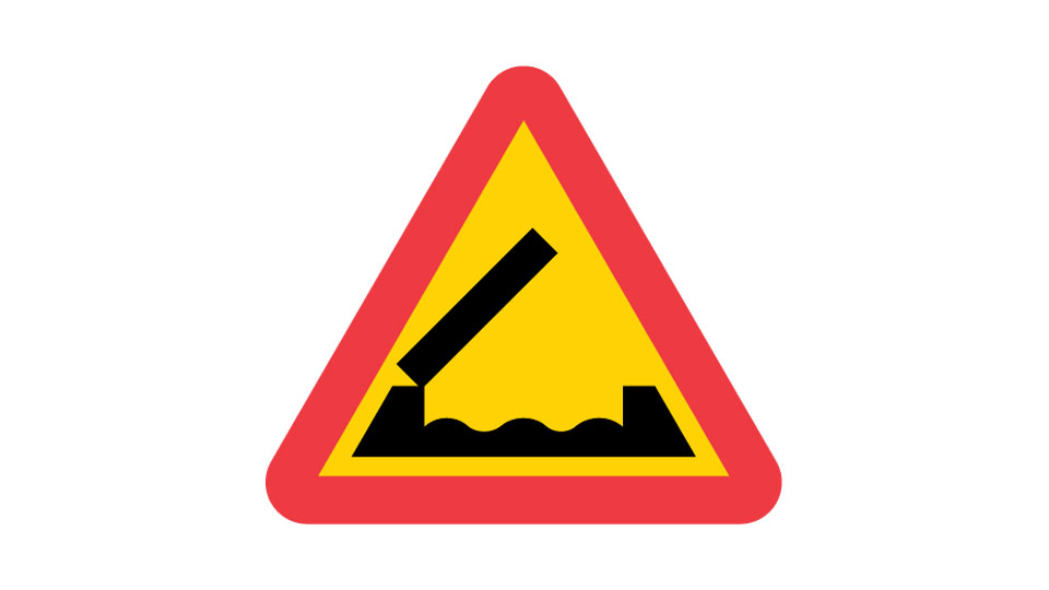 Red-and-yellow triangle with a raised bridge section above waves.